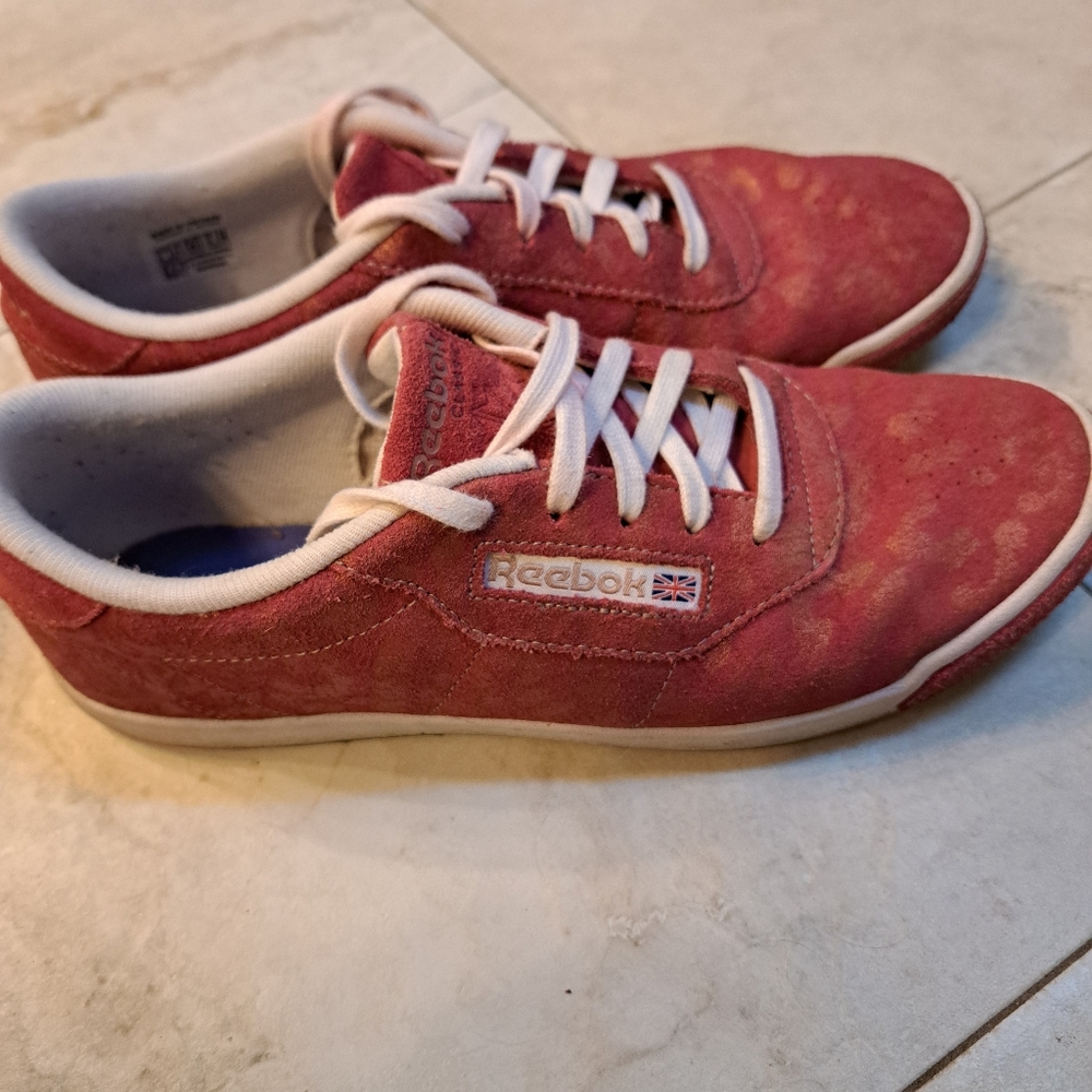 Reebok red tennis shoes with animal print